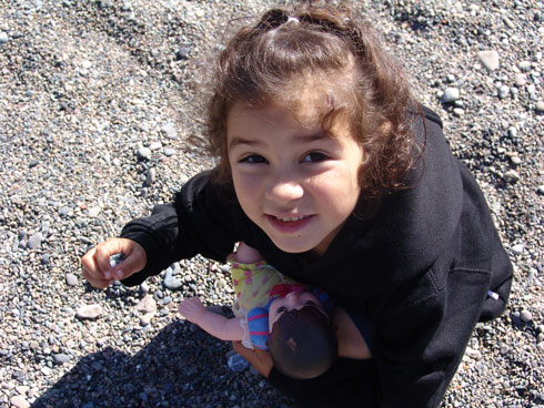 Girl playing with rocks